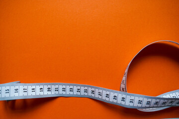 White centimeter tape on paper background. Free Space. Lost Weight concept