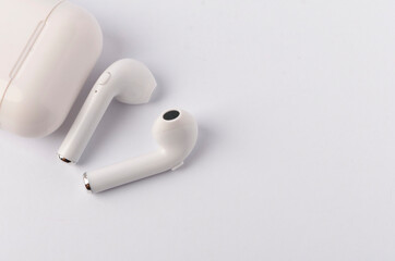 A white wireless headphone on white background.