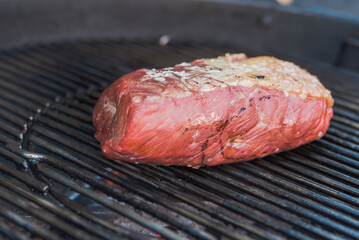picanha a piece of meat on the bbq grill.