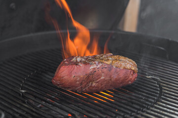 picanha a piece of meat on the bbq grill.