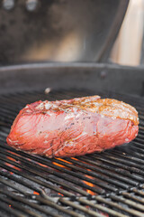 picanha a piece of meat on the bbq grill.