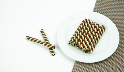 The two-tone wafer roll stick chocolate flavor on white background.