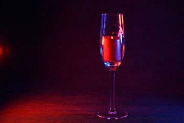 Candle with smoke and flame photographed in the studio with color foils before the flashes