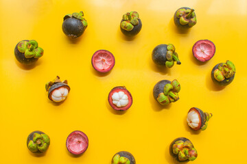 mangosteen fruit of Thailand on yellow background. soft focus.