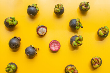 mangosteen fruit of Thailand on yellow background. soft focus.