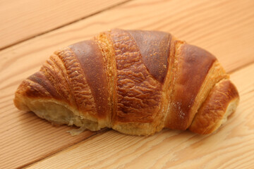 French croissants on a wooden board. 