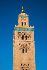 Fototapeta premium view of Koutoubia Mosque (Kutubiyya or Jami' al-Kutubiyah Mosque) the largest mosque located in the medina quarter of Marrakesh, Morocco