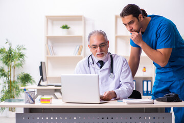 Two male doctors working in the clinic