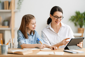 Fototapeta premium Girl doing homework or online education.