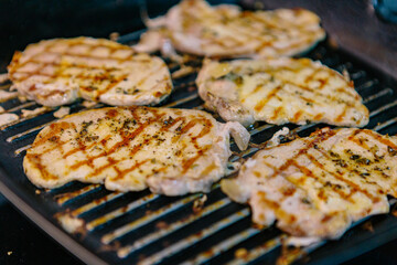 Delicious pork tenderloin cooked on the grill with oil and spices. Real Food.