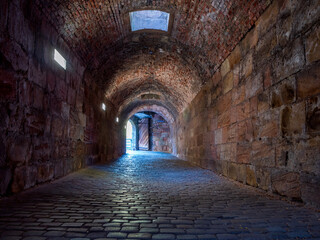 Underground passage under old medieval fortress.