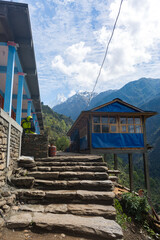 Colorful Tea Houses and Stone Steps on Mountain Trail in Nepal on Annapurna Base Camp Trek