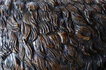 Close up Fur of Bronze Bear Statue Texture Background.