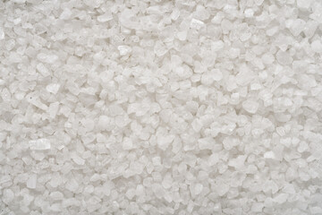 Sea salt granules close-up macro shot background or texture