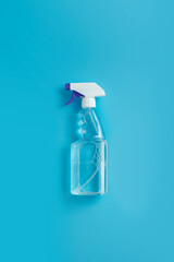 Disinfection and cleaning spray bottle on green background