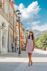 young woman travels in the old city of Montenegro
