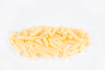 Raw penne pasta on a white background