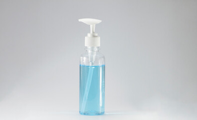 Hand sanitizer bottle, white pump head, clear bottle on a white background