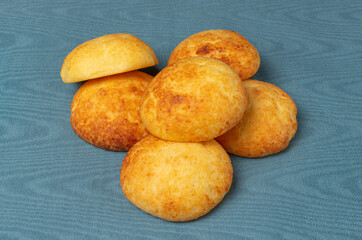 Typical colombian almojabanas, traditional colombian cheese bread on blue background. Traditional bakery