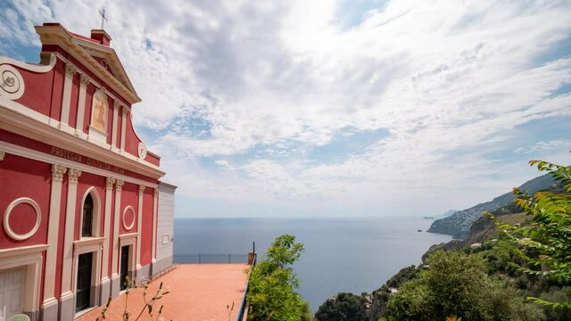 time lapse of Apostolic Church of San Giovanni Battista (Baptist) overlooking the sea of the Amalfi coast. Conca dei Marini, Salerno, Campania, Italy