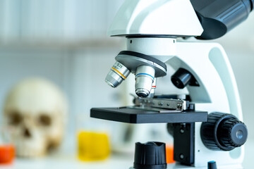 hands of medical doctor scientist wearing protective blue gloves holding sample tube blood sample in science laboratory equipment to diagnosis for corona virus covid-19 virus pandemic