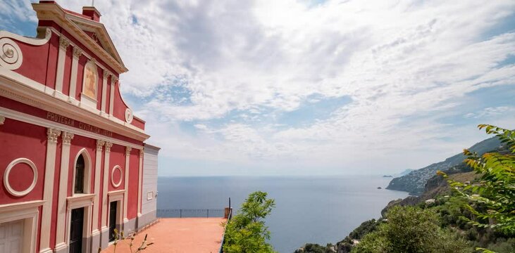 time lapse of Apostolic Church of San Giovanni Battista (Baptist) overlooking the sea of the Amalfi coast. Conca dei Marini, Salerno, Campania, Italy