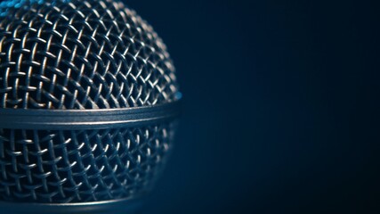 Macro shot of a stage mic professional vocal microphone - black background