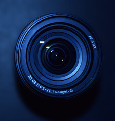 Close up of 18-140MM DSLR or Digital Camera Zoom Lens isolated in bluish background