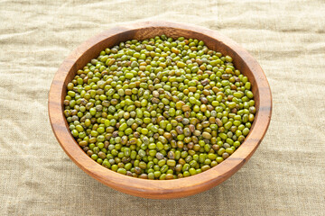 Mung beans or mash peas in wooden bowl