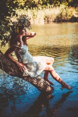 Girl in a wreath of wildflowers at the festival Midsummer