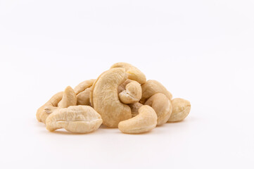 Cashew nuts in the heap isolated on white background