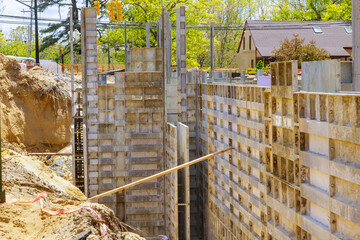 Formwork construction concept unfinished house on the metal formwork holders