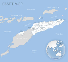 Blue-gray detailed map of East Timor administrative divisions and location on the globe.