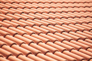 Closeup of orange red clay roof tile seamless pattern for house covering in red color