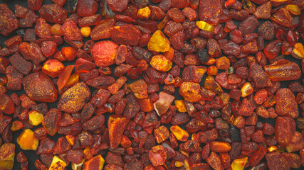 Amber stones natural background pattern, flat lay