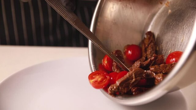 The chef prepares a salad from farm products. In the kitchen of a top restaurant