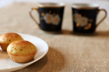 Appetizing muffins on the plate. Selective focus.