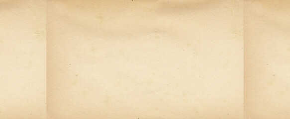 Old brown paper parchment background design with distressed vintage stains and ink spatter and white faded shabby center, elegant antique beige color