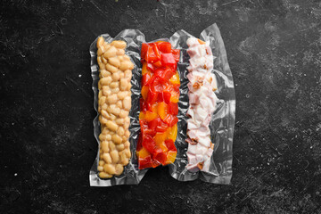 Vacuumed food: bacon, beans and vegetables. Preparation for soup. Top view. Free space for your text.