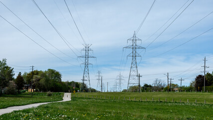 Obraz premium bike path beside electric power lines