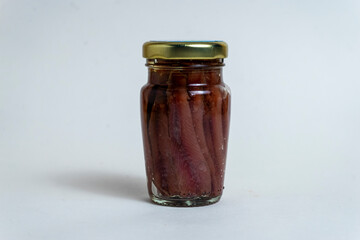 anchovies in a jar, white background