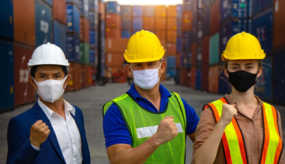 Industrial workers or engineers wearing Coronavirus or COVID-19 protective masks
