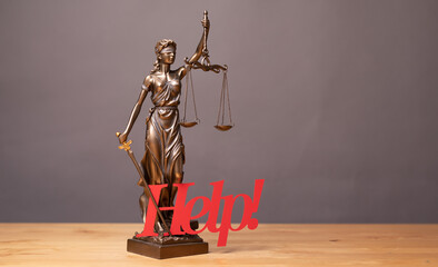 Legal and law concept statue of Lady Justice with scales of justice.