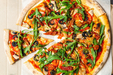 Delicious Italian top view.Fast food delivered in cardboard box.Tasty natural ingredients baked in...