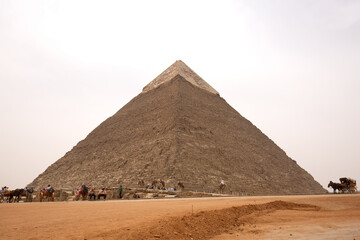 Fototapeta na wymiar GIZA, EGYPT, APRIL 20: Tourists visits the second largest Pyramids of Kahfre at Giza complex, Cairo, Egypt on April 20, 2018