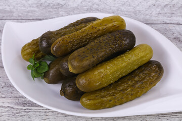 Pickled cucumbers heap in the bowl