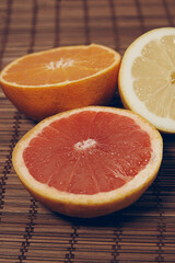 grapefruit orange lemon on wooden background