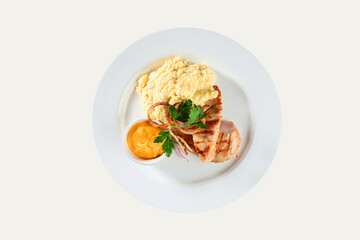 Grilled chicken breast with wheat porridge. An isolated object.Top view.
