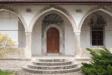 the entrance is through the arches in the Eastern style