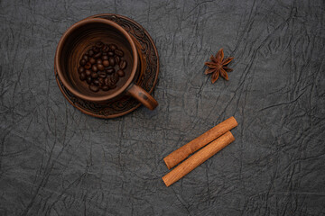 Homemade cup and saucer made of glazed clay.